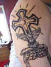 cross and bird tattoo